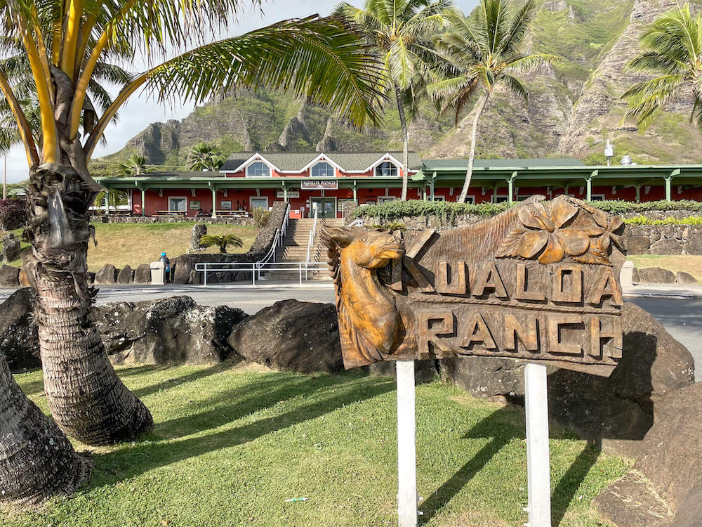 Findo ut the best things to do at Kualoa Ranch on Oahu by top Hawaii blog Hawaii Travel with Kids. Image of the Kualoa Ranch sign