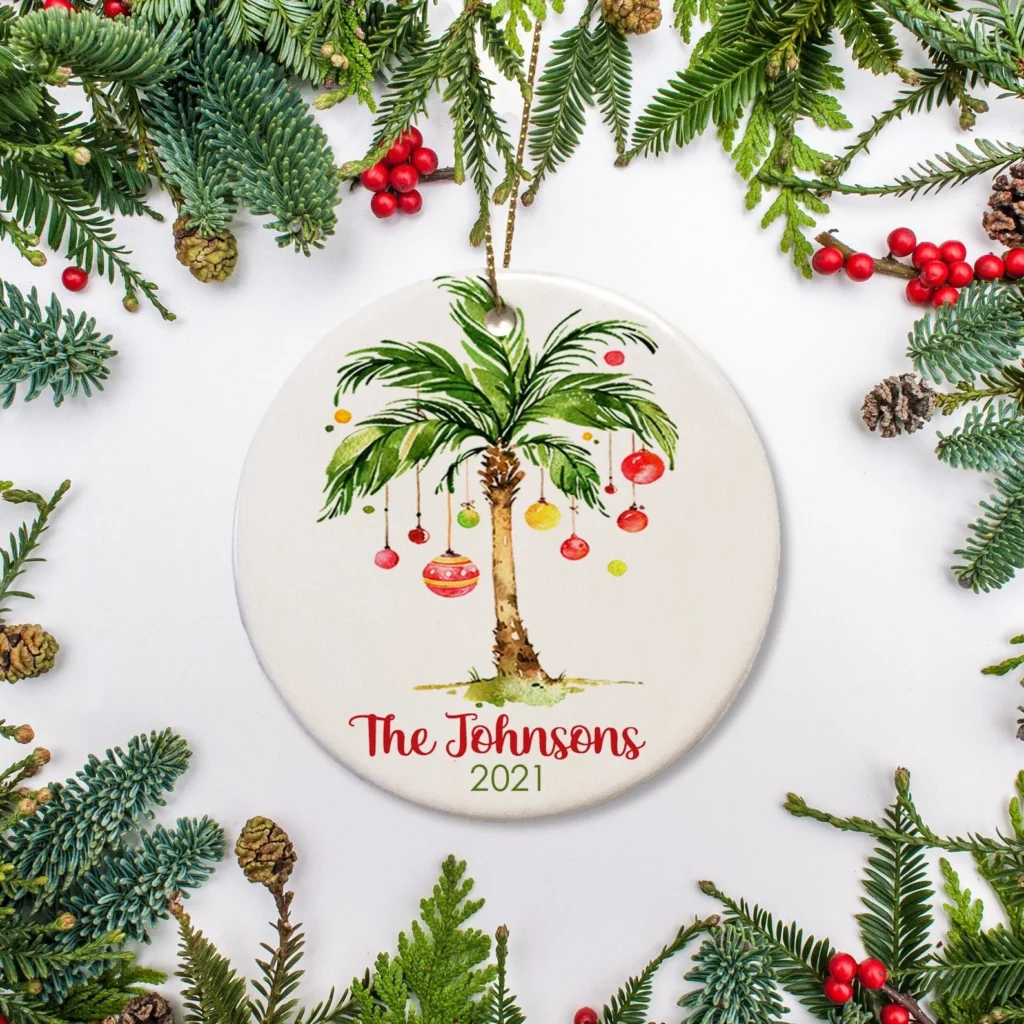Image of a Christmas ornament with a palm tree with ornaments hanging from it with the text The Johnsons 2021 on it.