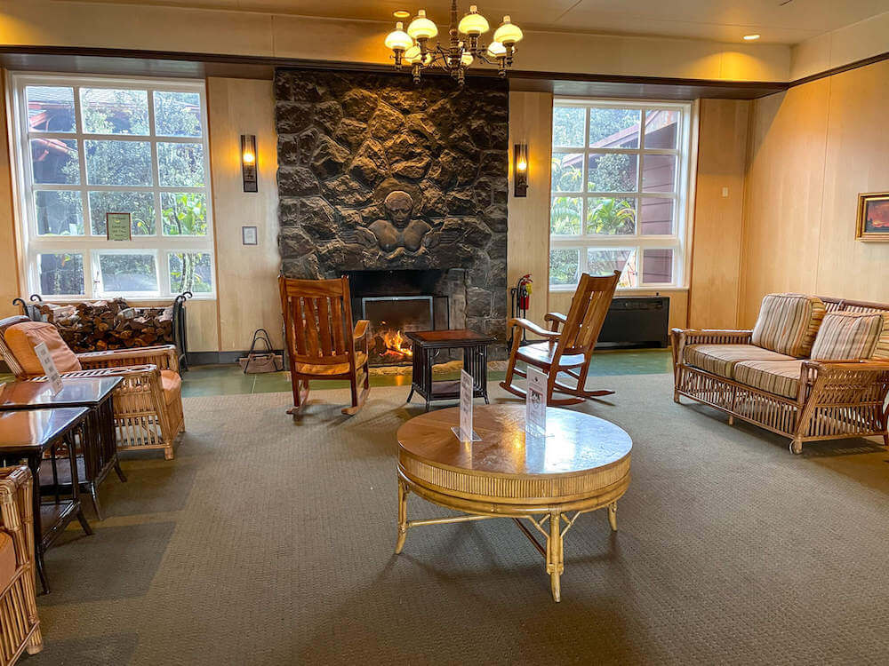 Image of wooden rocking chairs by a fire at Volcano House in Hawaii.