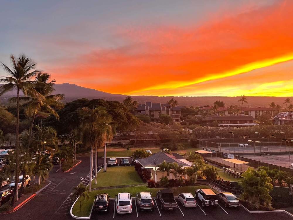 Image of the sunrise over a parking lot on the Big Island of Hawaii.