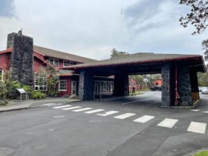 Check out this honest Volcano House Review by top Hawaii blog Hawaii Travel with Kids. Image of a historic hotel in Hawaii.