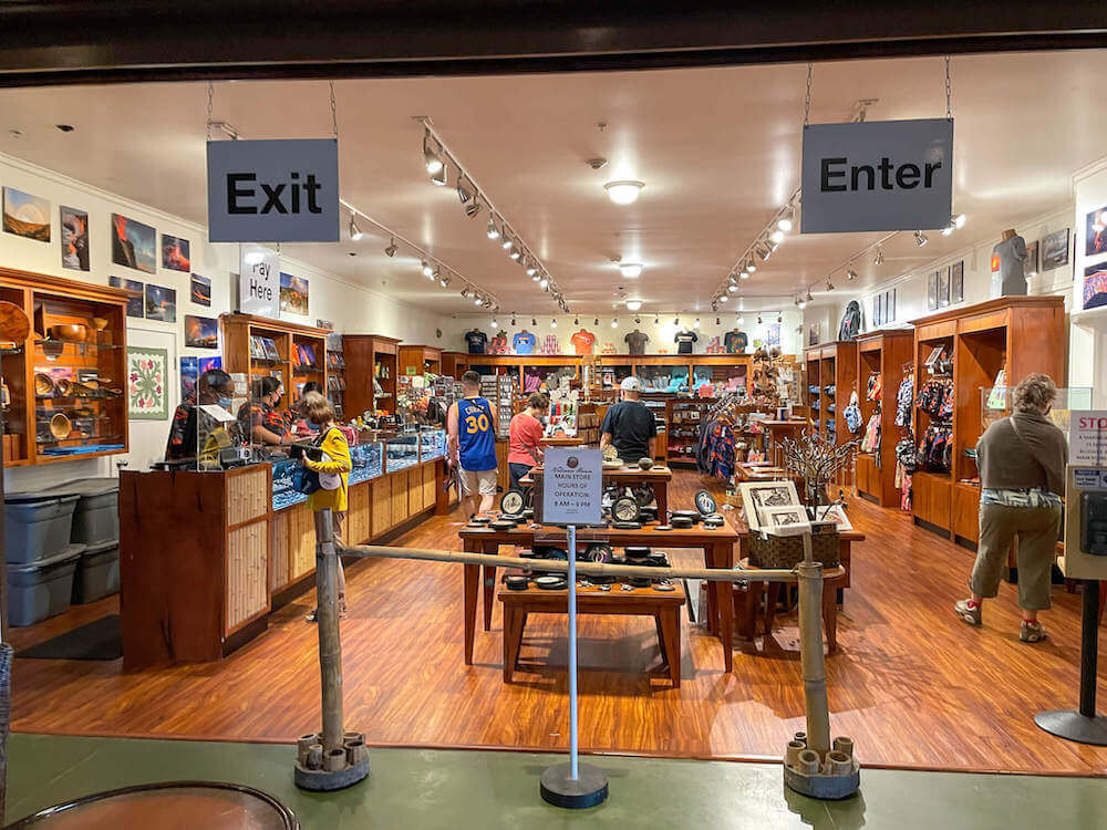 If you're heading to Hawaii Volcanoes National Park with kids, you'll definitely want to scope out the gift shop at Volcano House. Image of a store packed with volcano merchandise.