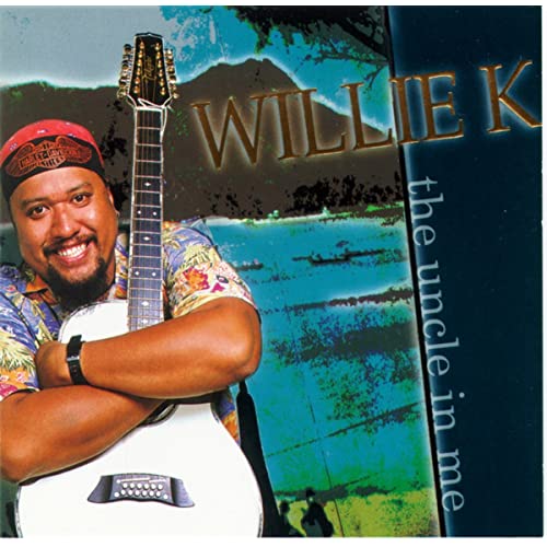 Image of Willie K holding a guitar on his album cover.