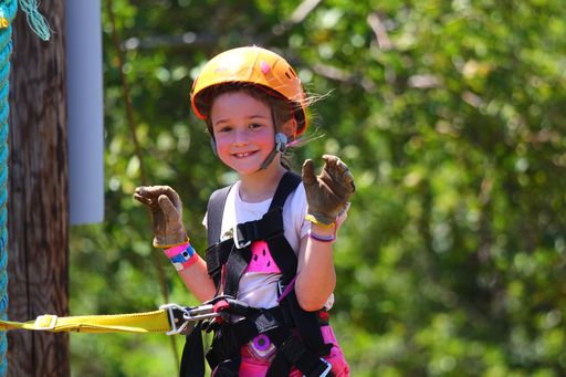 Image of a girl smiling while getting ready to go ziplining on Maui Hawaii.