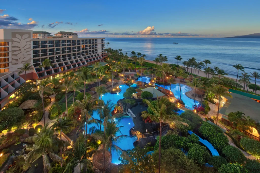 Image of a tropical Maui resort with an amazing pool area at dusk.
