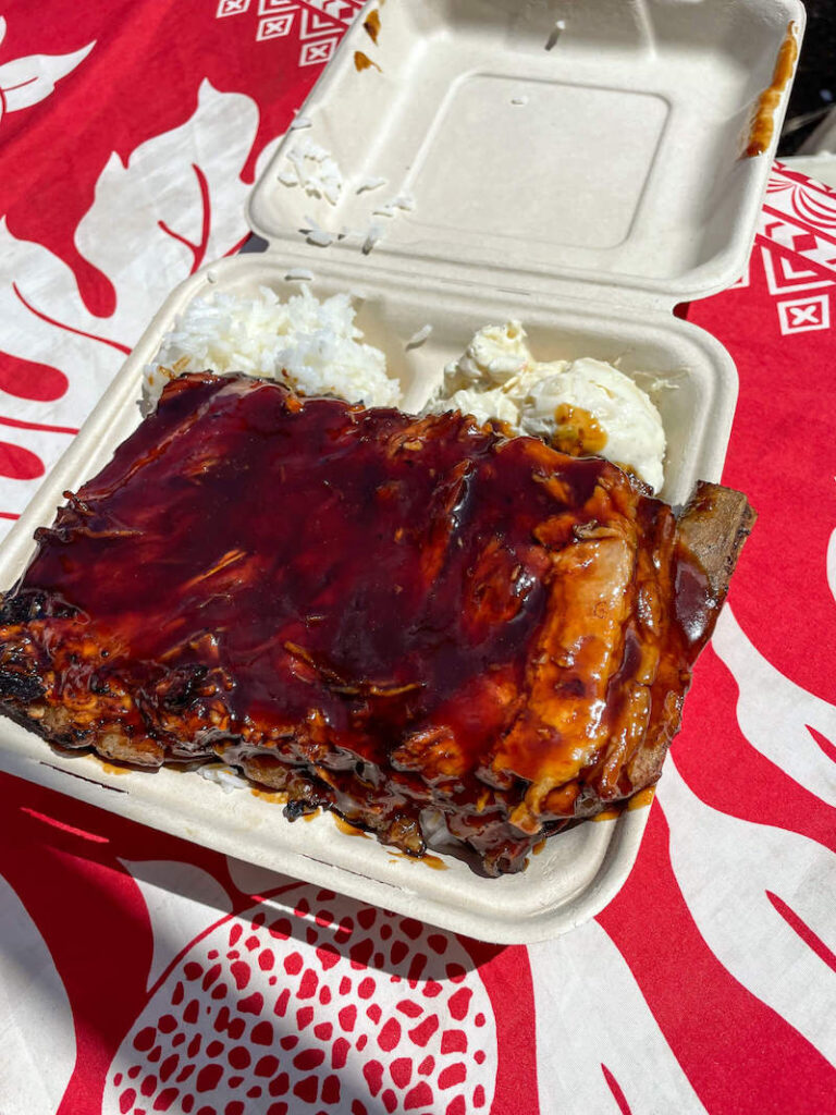 Image of a big stack of ribs in a takeout container at Bruddah Hutts food truck in Hana Maui.