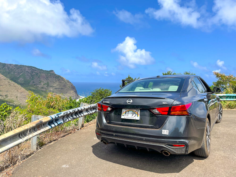 Image of a Nissan Altima along the road to Halawa Valley on Molokai.