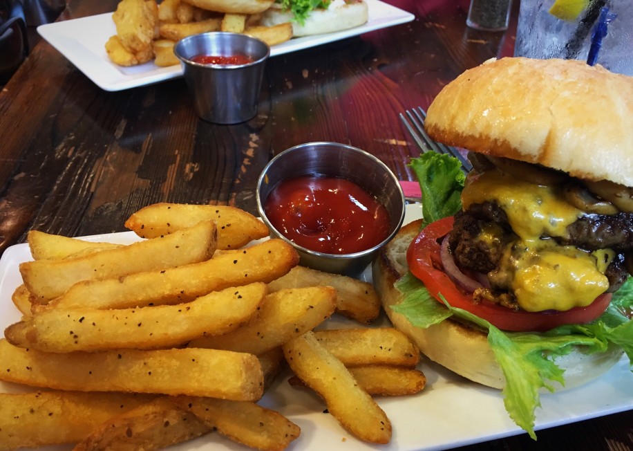 Image of a hamburger and french fries at Cheeseburger in Paradise.