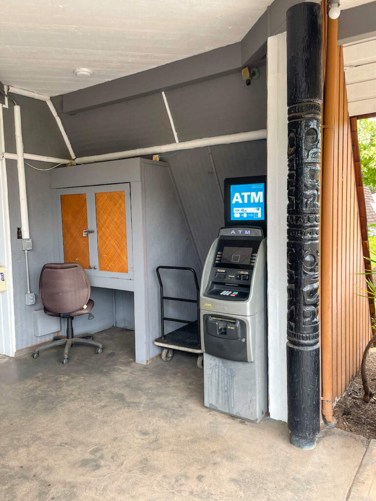 Image of an outdoor ATM and a business center where the computer is locked up.