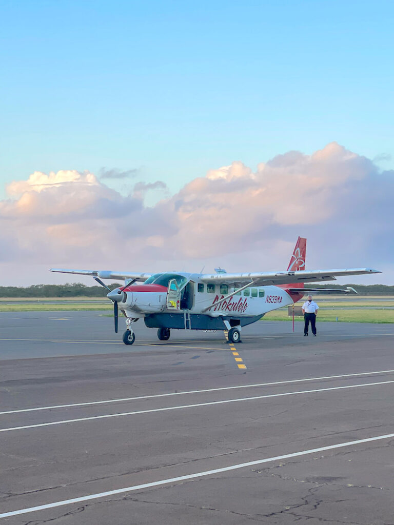 Image of a 10 passenger Mokulele airplane on the runway on Moloka'i.
