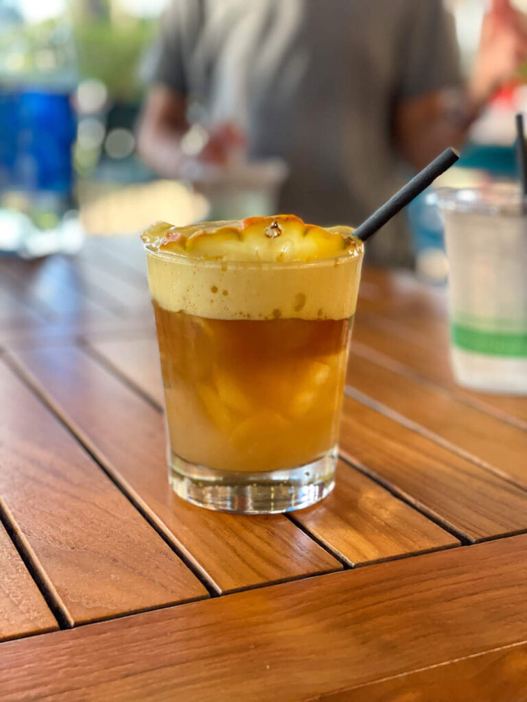 Image of a mai tai topped with lilikoi foam at Monkeypod Kitchen on Maui.