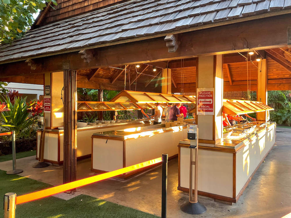 Image of three buffet stations set up in an outdoor undercover area.