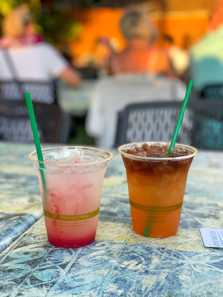 Image of two cocktails in plastic cups.