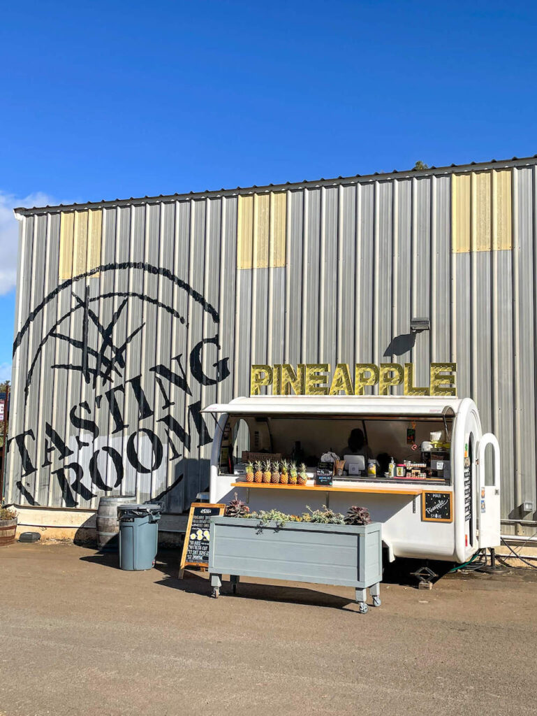 Image of a Maui pineapple food truck in front of the Hali'imaile tasting room