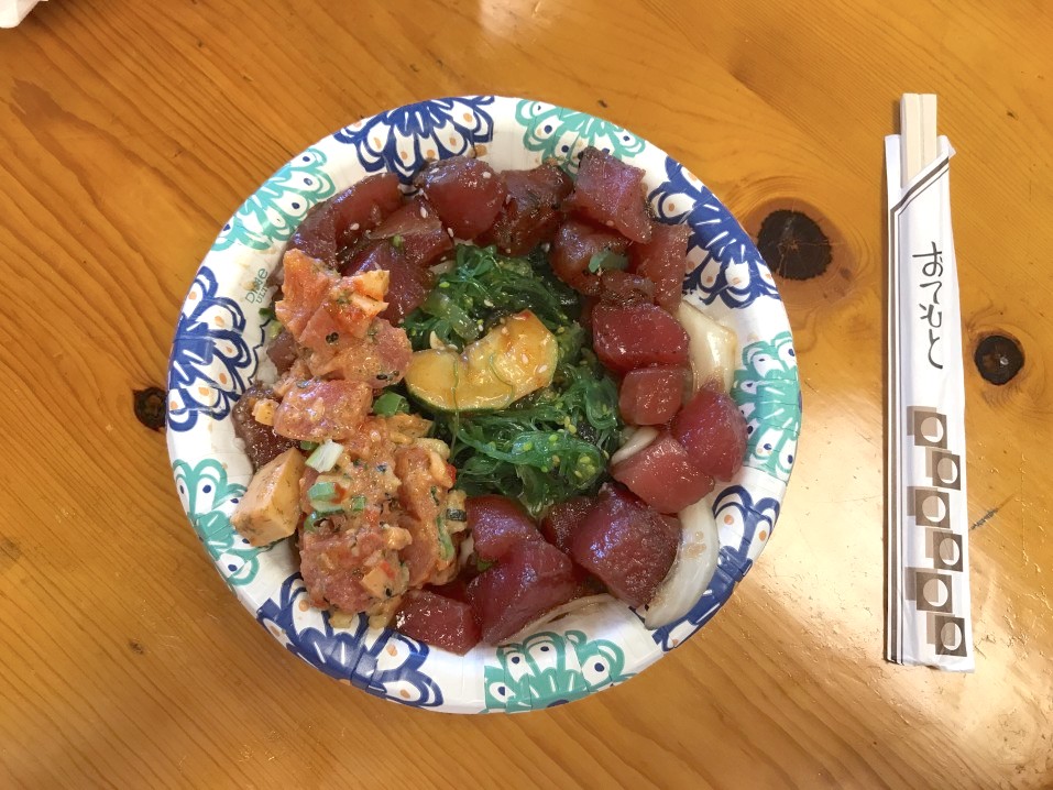 Image of a poke bowl in a paper bowl.