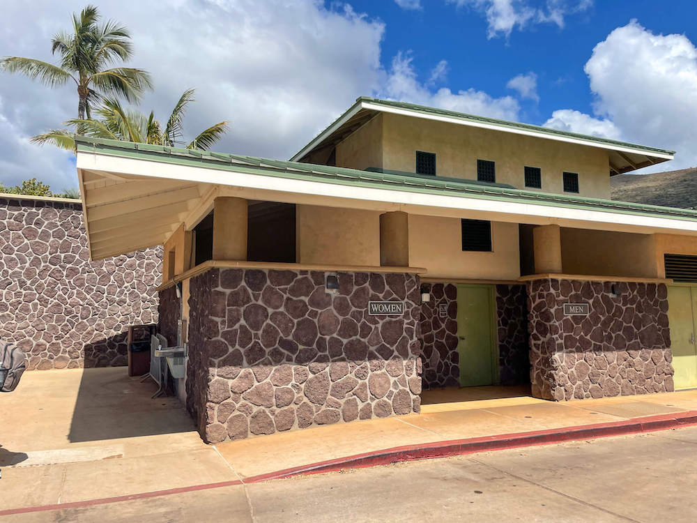 Image of a nice restroom building with rockery.