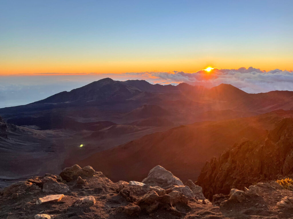 Image of the sunrise over a crater on Maui