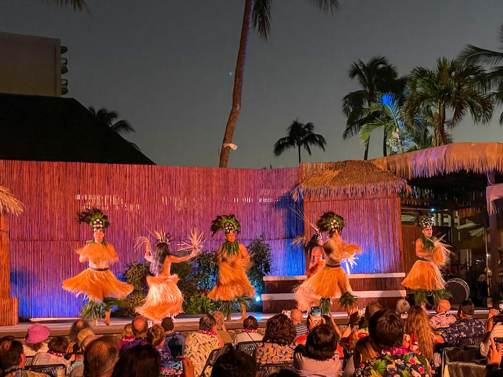 Image of men and women doing Tahitian dancing at the Myths of Maui luau.