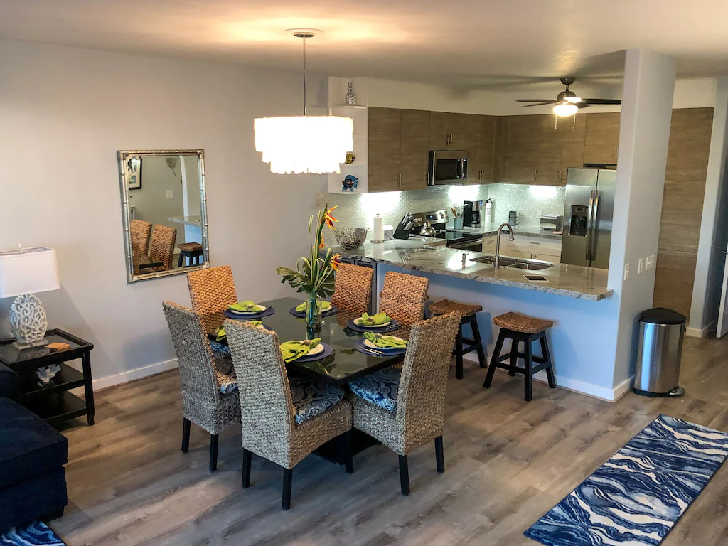 Image of a nice kitchen and dining area at at Kauai condo