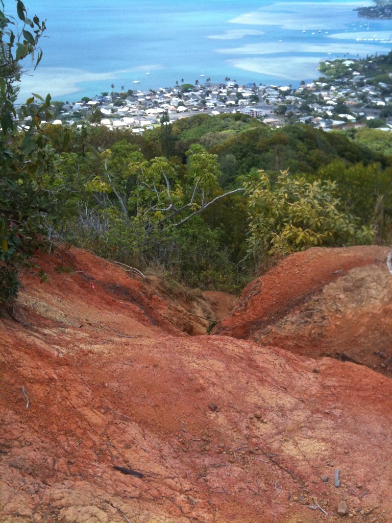 Image of a red dirt hill overlooking Kaneohe Oahu