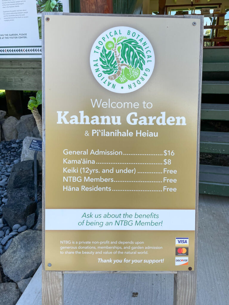 Image of a sign for Kahanu Garden and Pi'ilanihale Heiau with admission rates.