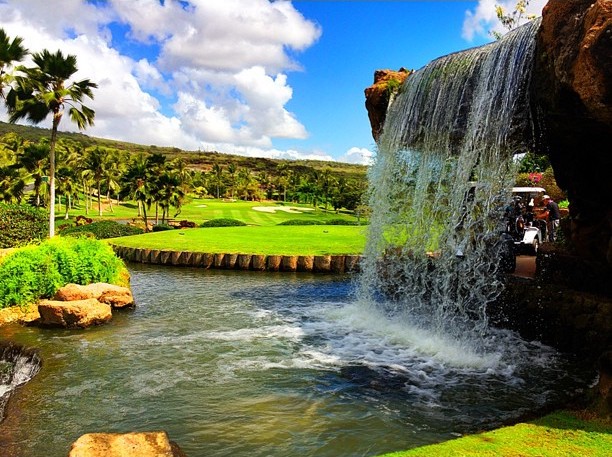 Image of an Oahu golf course with a waterfall.