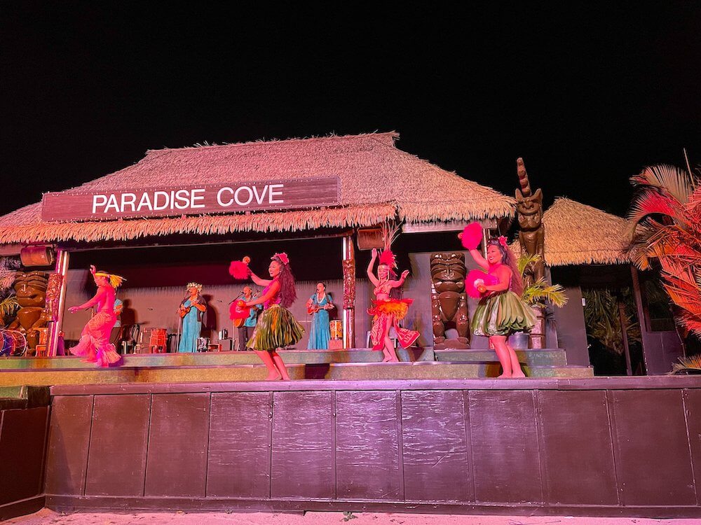 Image of the Paradise Cove luau stage with hula dancers and Tahitian dancers