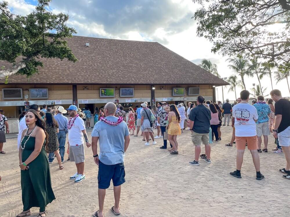 Image of a bunch of lines in front of an outdoor bar.