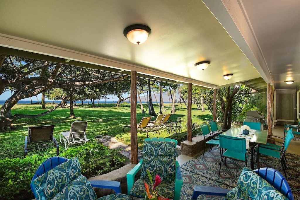 Image of a bunch of blue outdoor furniture in a covered patio area