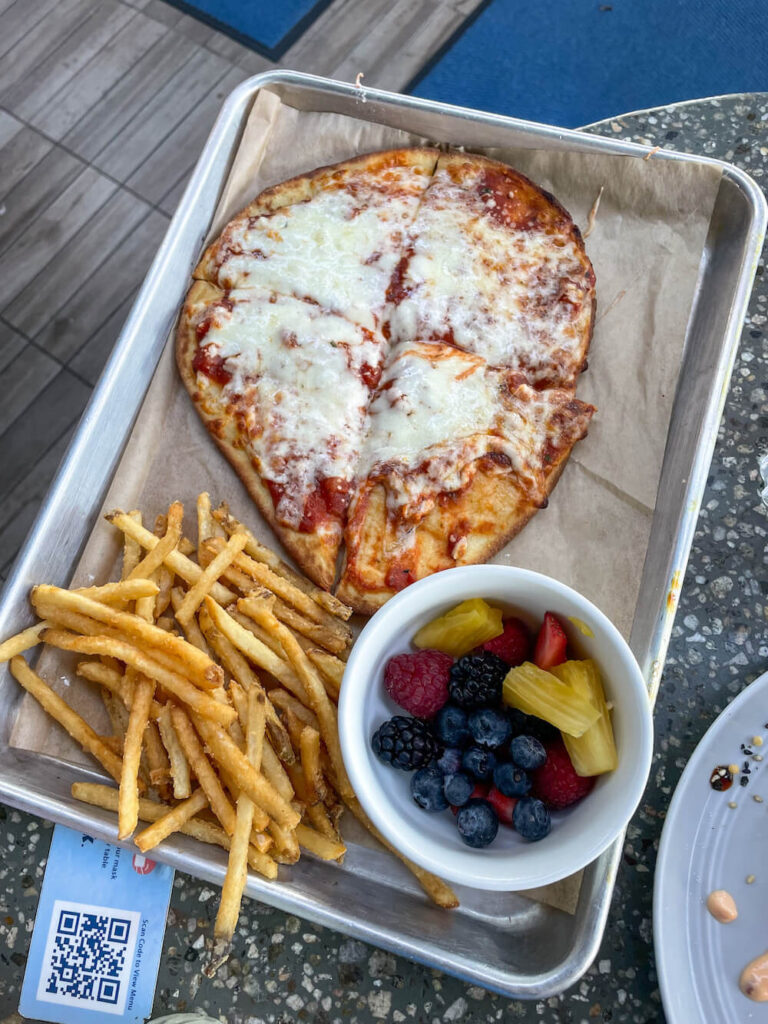 Image of kids pizza, fries, and fruit