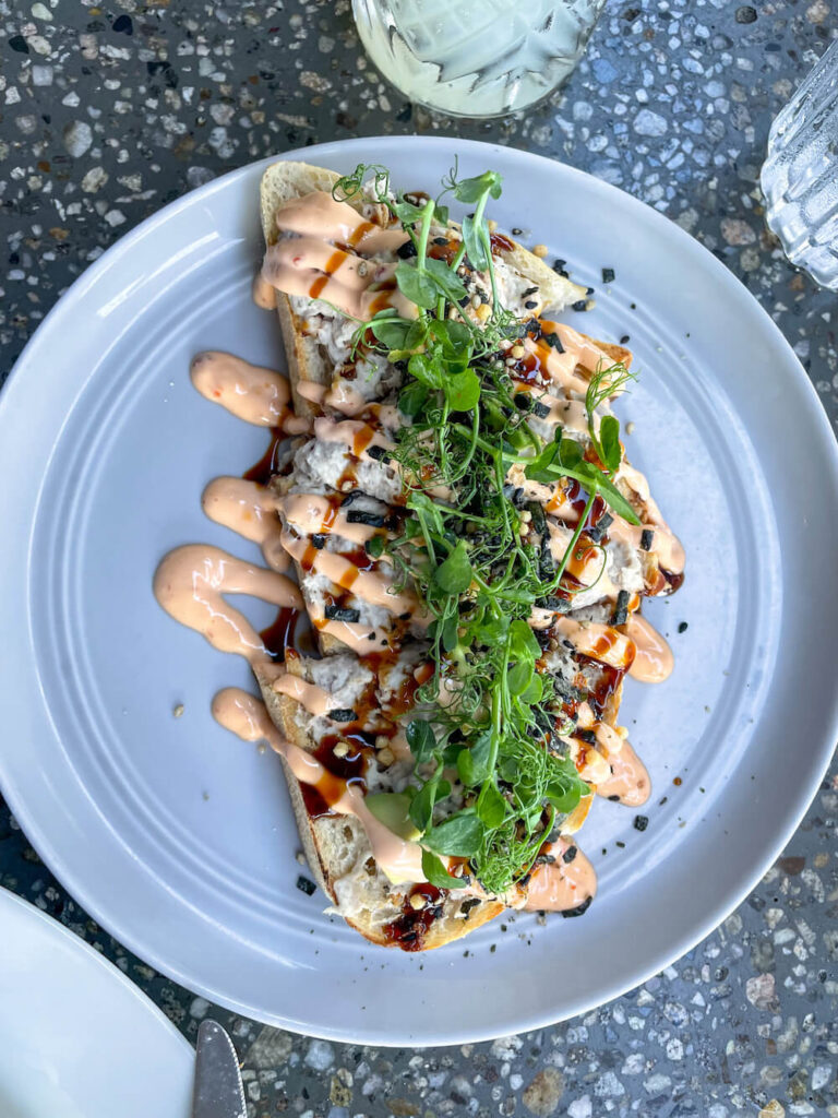 Image of bread topped with greens