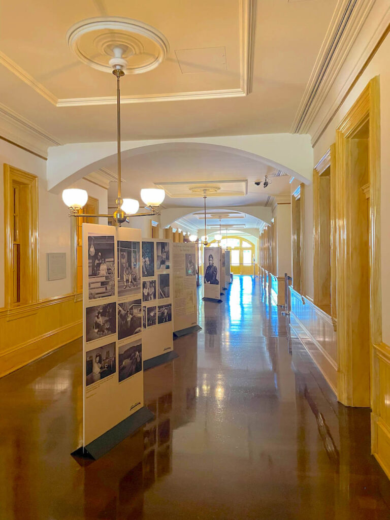 Image of a stand up Hawaiian history exhibits inside the basement at Iolani Palace.