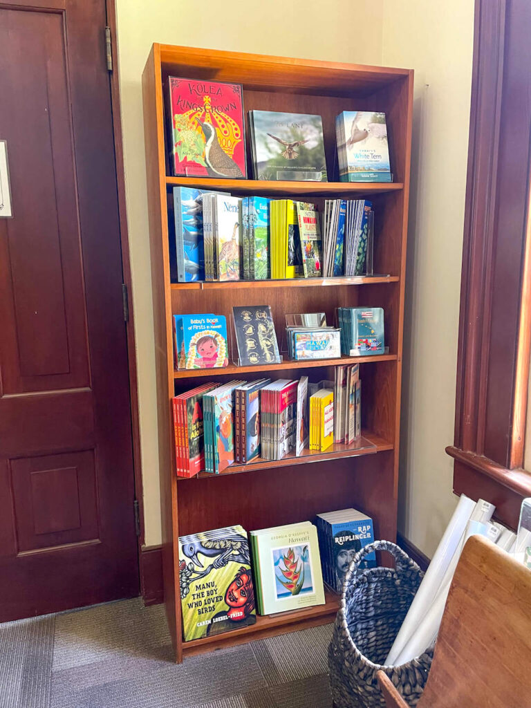 Image of a bookshelf filled with Hawaiian books.