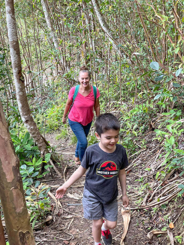 Image of a boy and grandma hiking in the jungle on Oahu