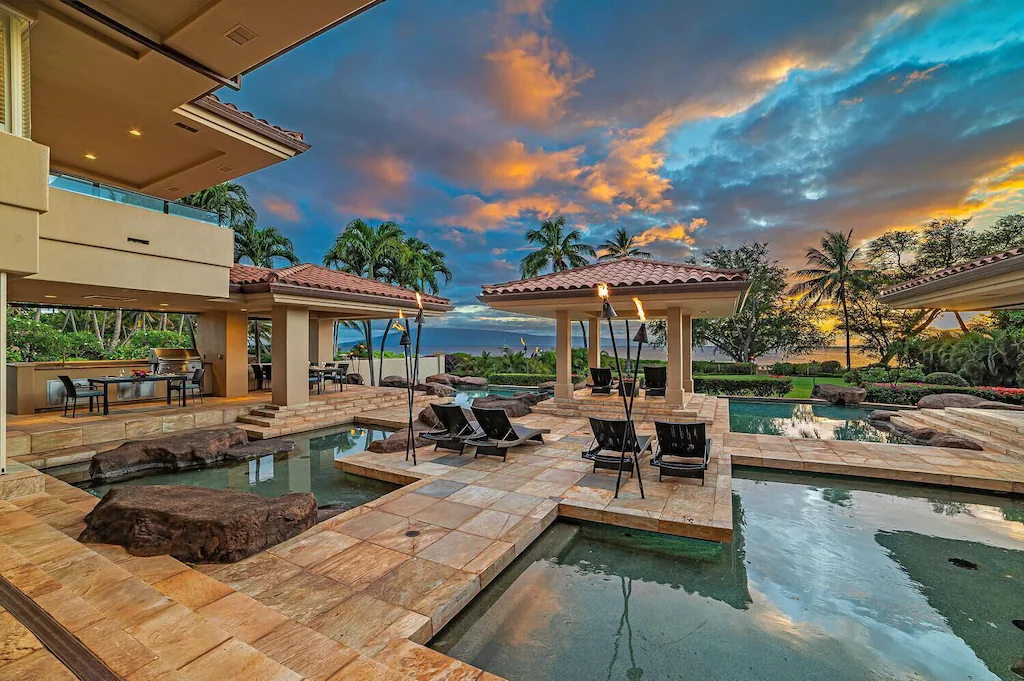 Image of tile pathways around 4 swimming pools at a mansion on Maui