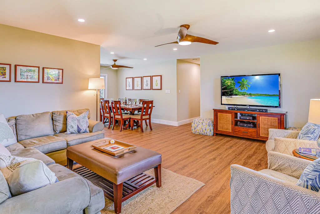 Image of a large living room and dining room space with wood floors