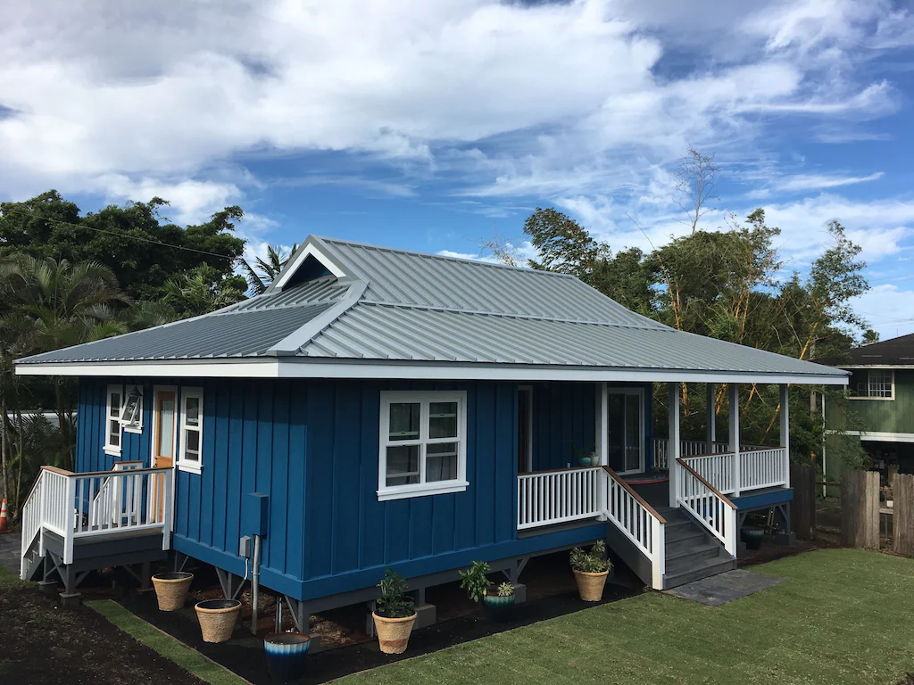 Image of a blue plantation style house on Maui