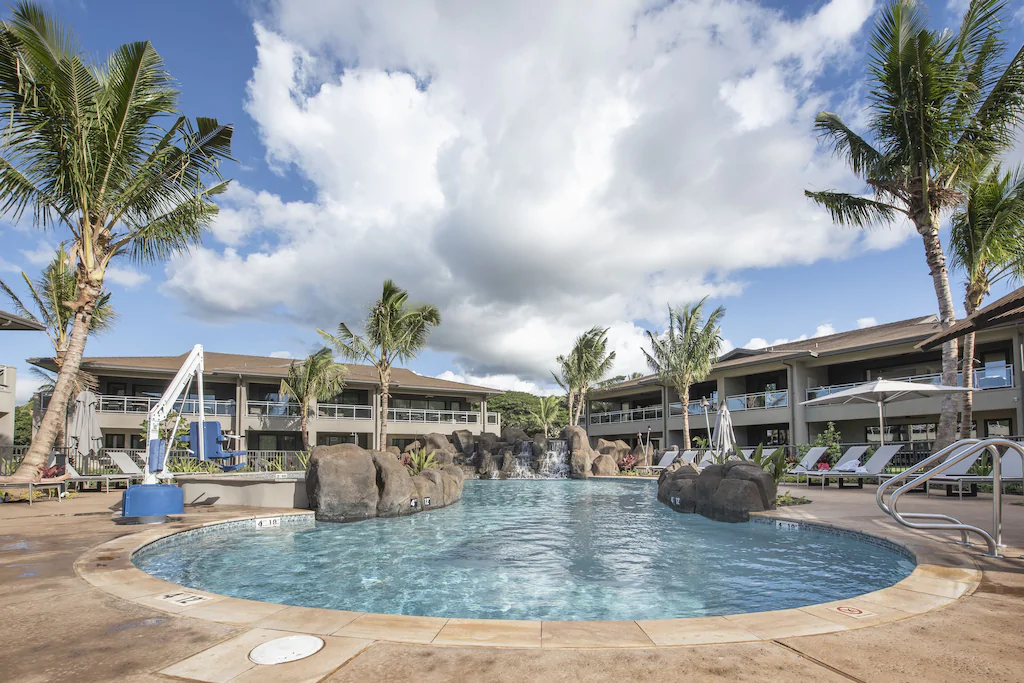 Image of a swimming pool surrounded by Maui villas