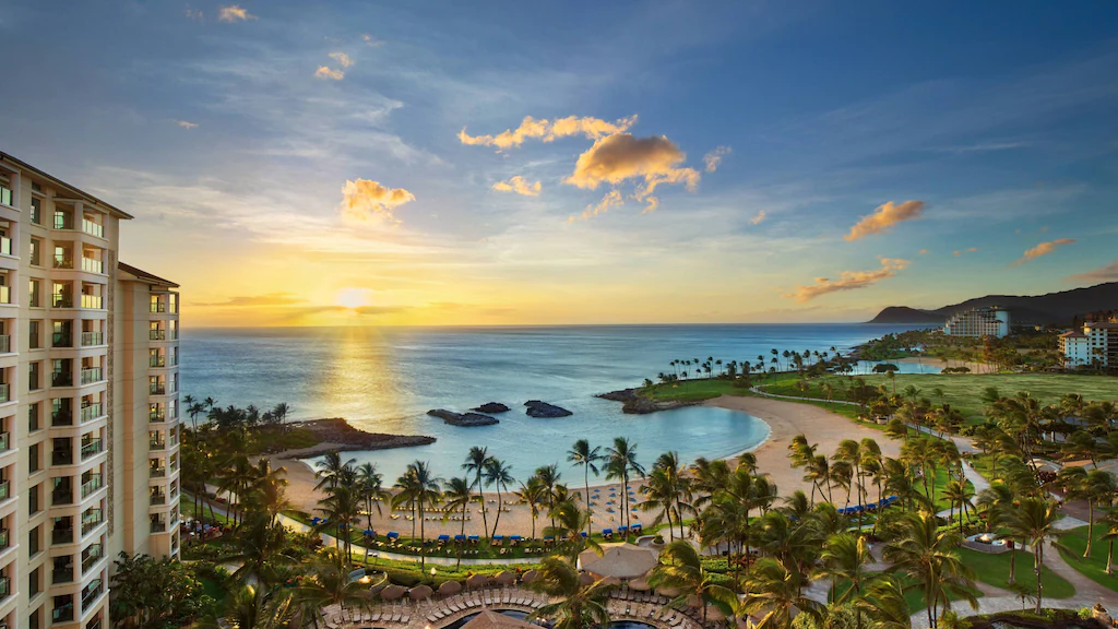 Image of a lagoon surrounded by palm trees and hotel buildings