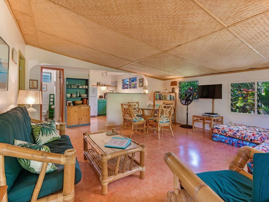 Image of a Maui living room with couches, chairs, and a dining set