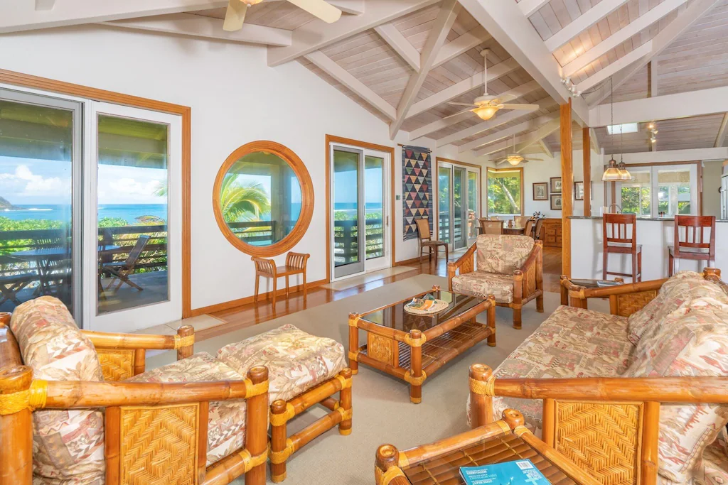 Image of brown wood living room set with a view of the ocean