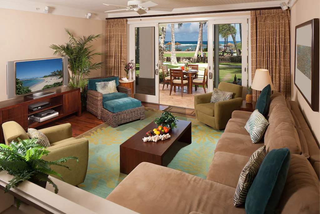Image of a living room that opens out to a patio on the ground floor of the Turtle Bay Resort on Oahu