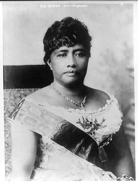 Image of Queen Liliuokalani wearing a sash in a black and white photo