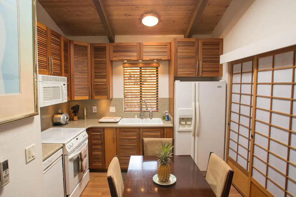 Image of a small kitchen and dining area inside a cottage on Maui