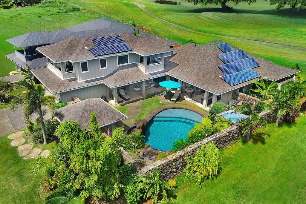 Image of a large house with a pool