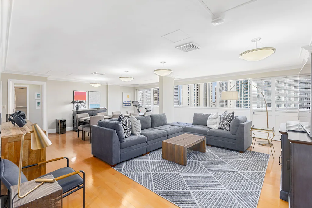 Image of a bright, airy living room at a Waikiki penthouse