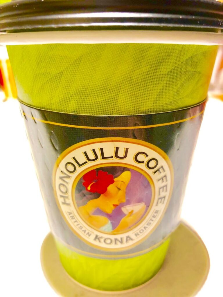 Image of a green Honolulu Coffee Company takeaway cup