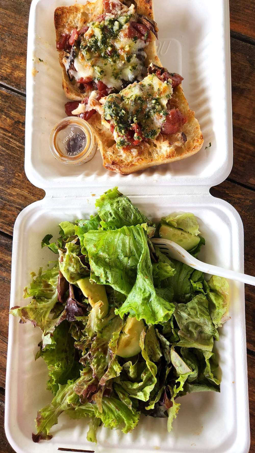 Image of french bread pizza and salad from Kahuku Farms on Oahu