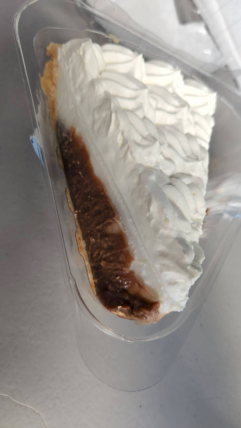 Image of a slice of chocolate haupia pie from Ted's Bakery on Oahu