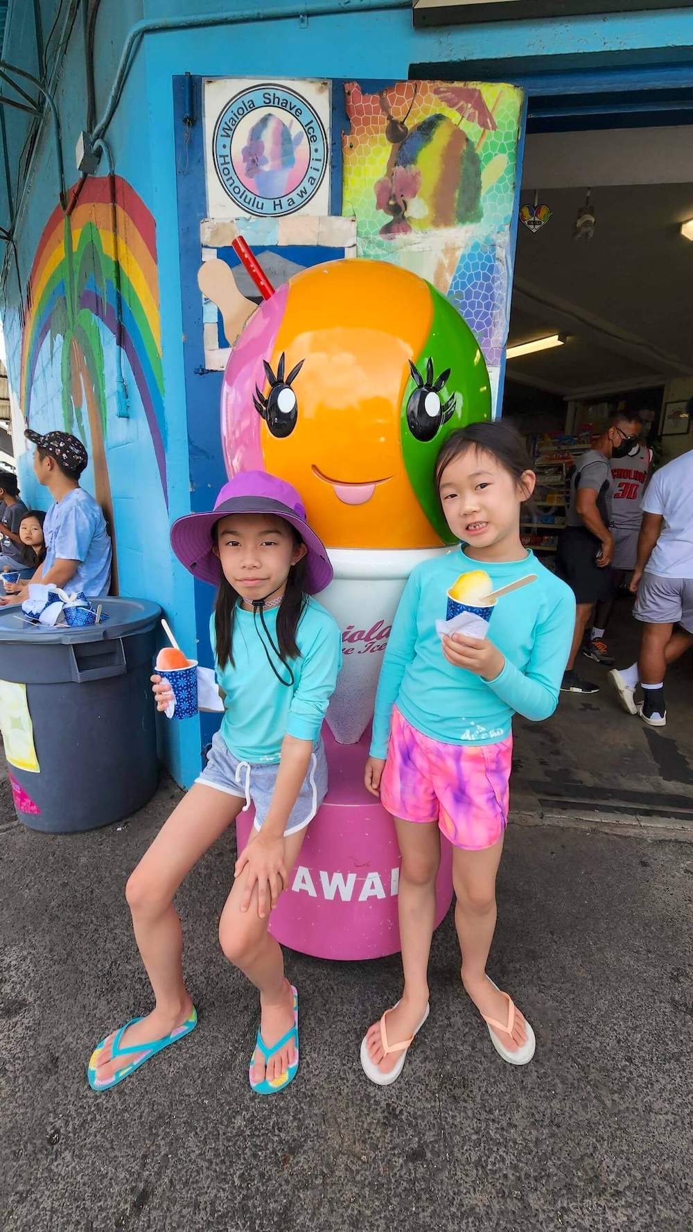 Image of two girls holding shave ice at Waiola Shave Ice on Oahu